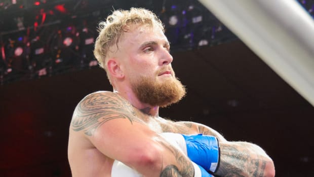 Boxer Jake Paul reacts to knocking out Andre August.